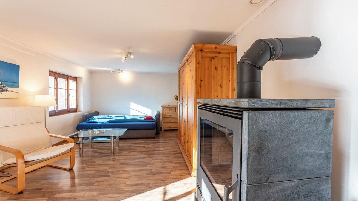 Kandergrund Ski Chalet | Cozy chalet with wood burning stove surrounded by Swiss Alps