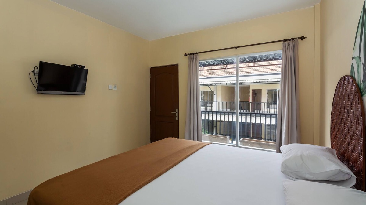 Denpasar Barat House | Cozy co-living that has two buildings separated by a pool to cool down and relax