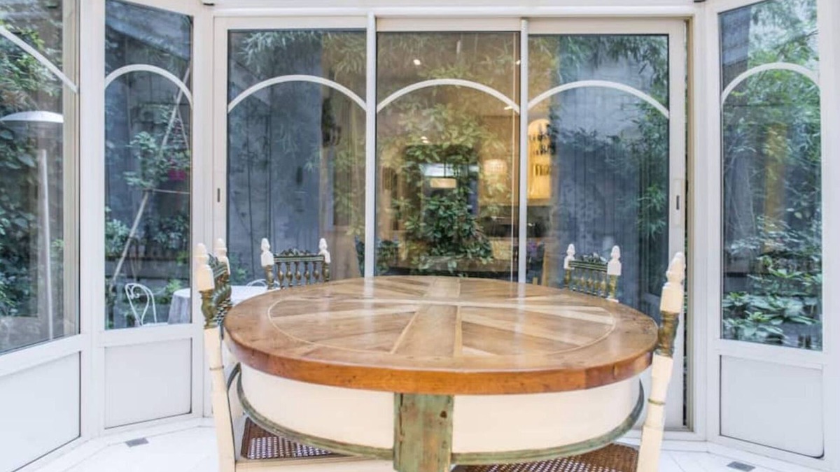 16th Arrondissement Apartment | Cozy Parisian style apartment with a veranda overlooking a private garden.