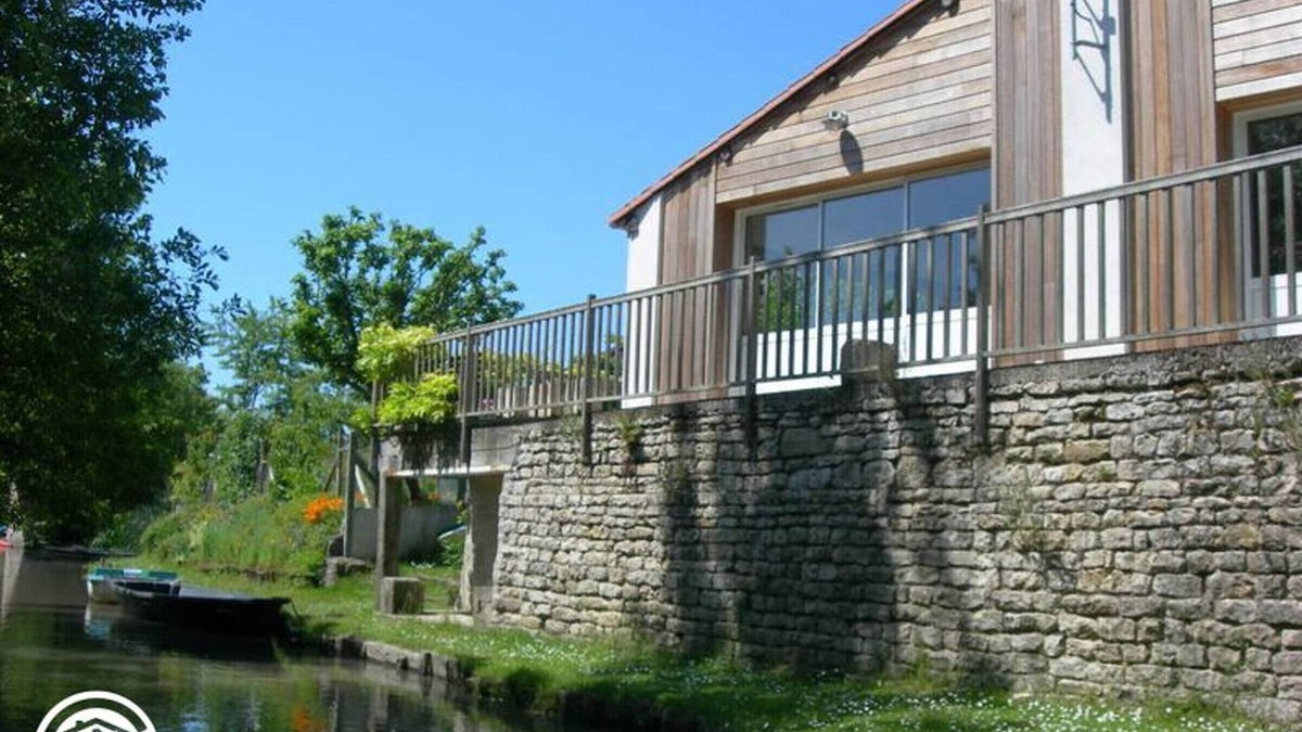 Damvix Cottage | Cozy Riverside Cottage with Canoes, Terrace & Garden in Charming Damvix