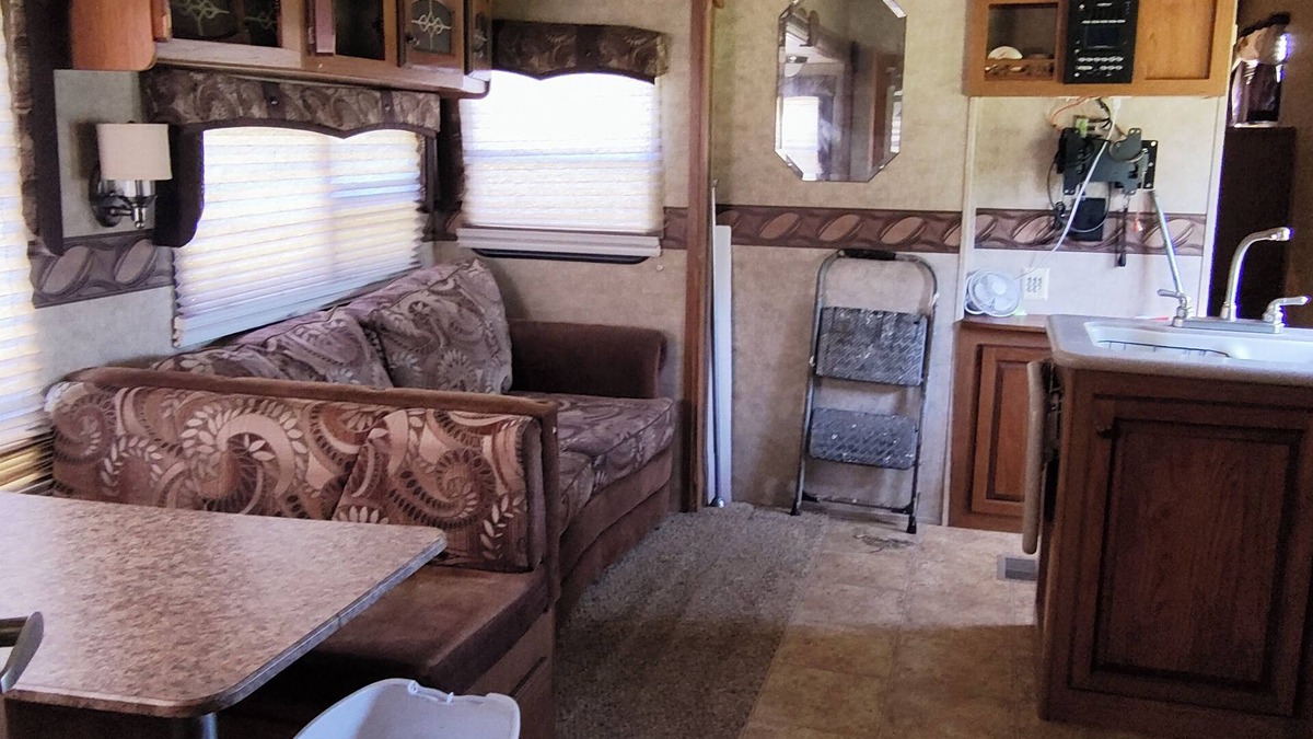 Ragley House | Cozy RV has 2 bedrooms, an outdoor kitchen with a grill & fridge