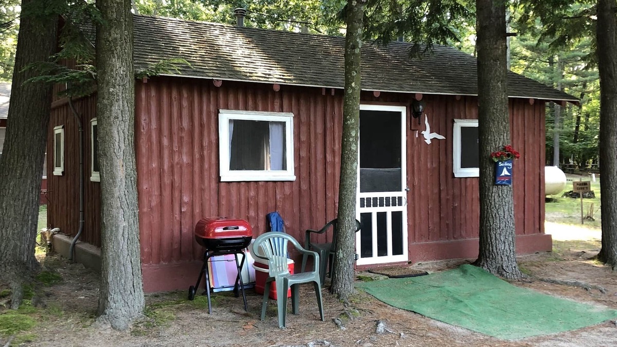 Pentwater Cabin | Cozy "Sailing" Cabin in the woods with Pentwater Lake frontage and access