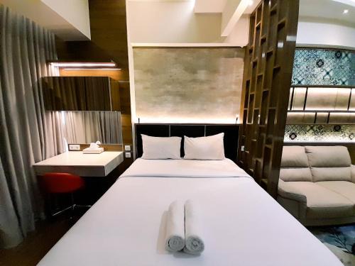 Catur Tunggal Apartment | Cozy Studio Room at Uttara The Icon Apartment By Travelio