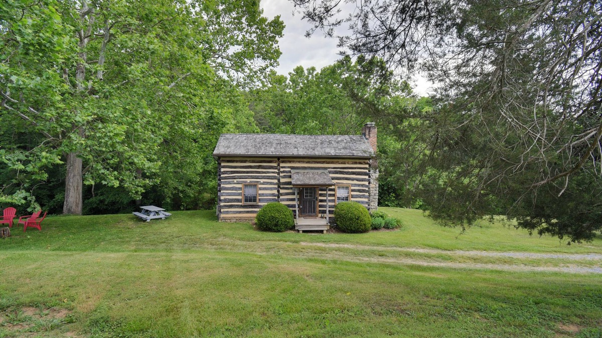 Raphine Cabin | Creekside historic log cabin w/modern amenities at historic Wade's Mill
