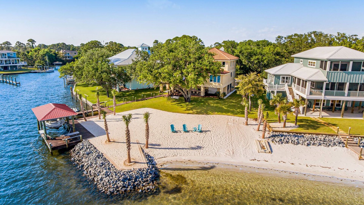 Gulf Breeze House | Delightful escape on the sound with beach access, dock, furnished deck, and WiFi