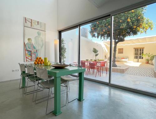 Carrion De Los Cespedes Apartment | Design & art, patio with orange tree, near Seville