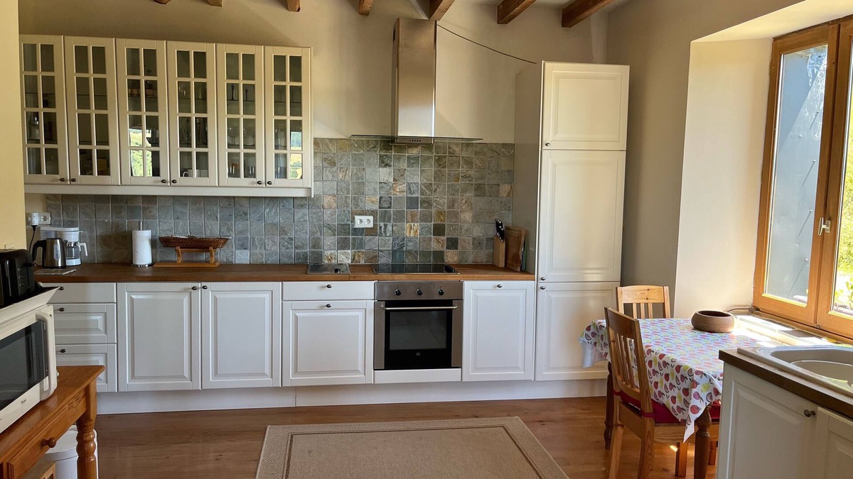 Compains Other | Distinctive farmhouse on a hillside with panoramic views over volcanic landscape