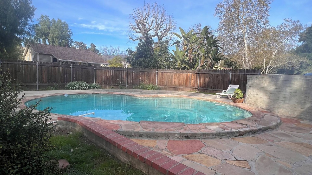 Sunland House | Dog friendly cottage with porch, pool, massive yard, and plenty of parking.