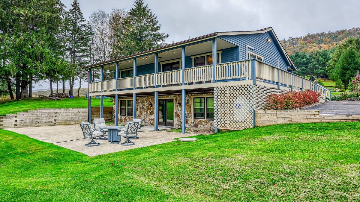 McHenry Cabin | Dog-friendly home with private pond, wraparound porch & fireplaces