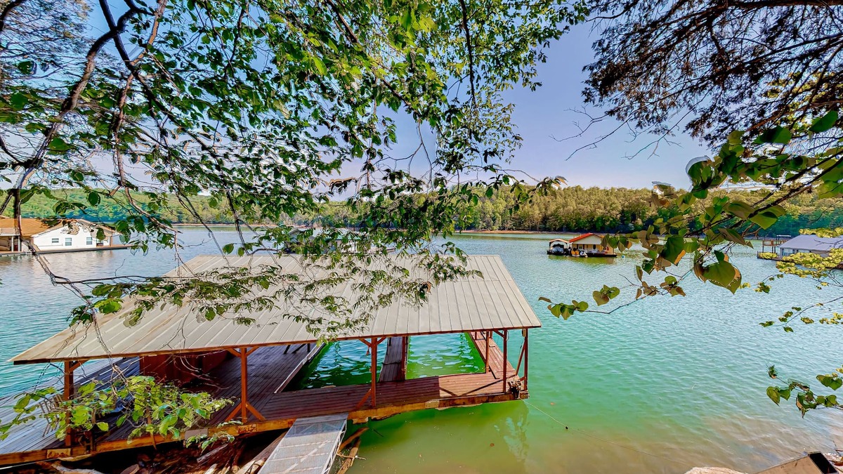 Flat Hollow Marina Cabin | Dog-friendly waterfront home with a firepit, grill, deck, board games, & dock