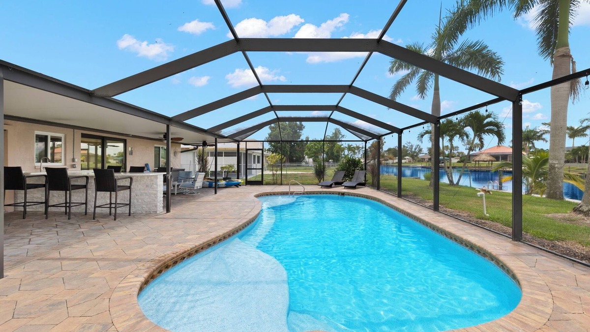 Caloosahatchee House | "DOUBLE CAPE ESCAPE".PRIVATE WATERFRONT OASIS W/HEATED POOL, DOCK & PATIO BAR
