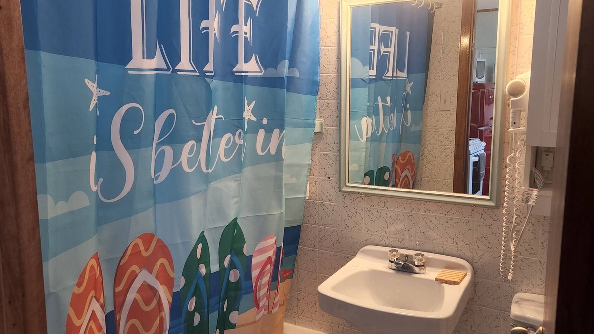 North Lake House | Enchanting pastel mint space created for families adjoining rooms with bathrooms