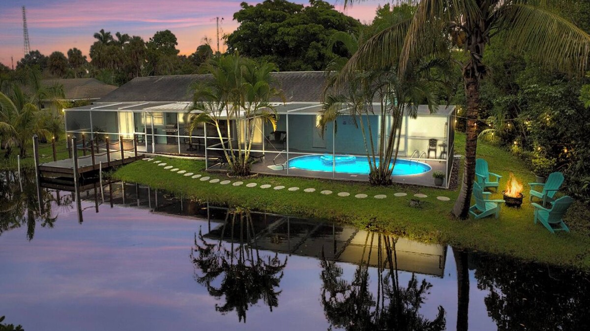 Fort Myers House | Enjoy a stunning waterfront view, pool table,kayaks, fishing, BBQ, heated & pool