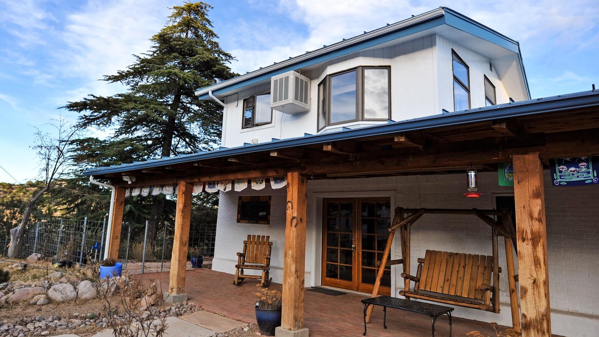 Tyrone Apartment | Enjoy Wildlife from Your Rocking Chair and Swinging Bench on Front Porch
