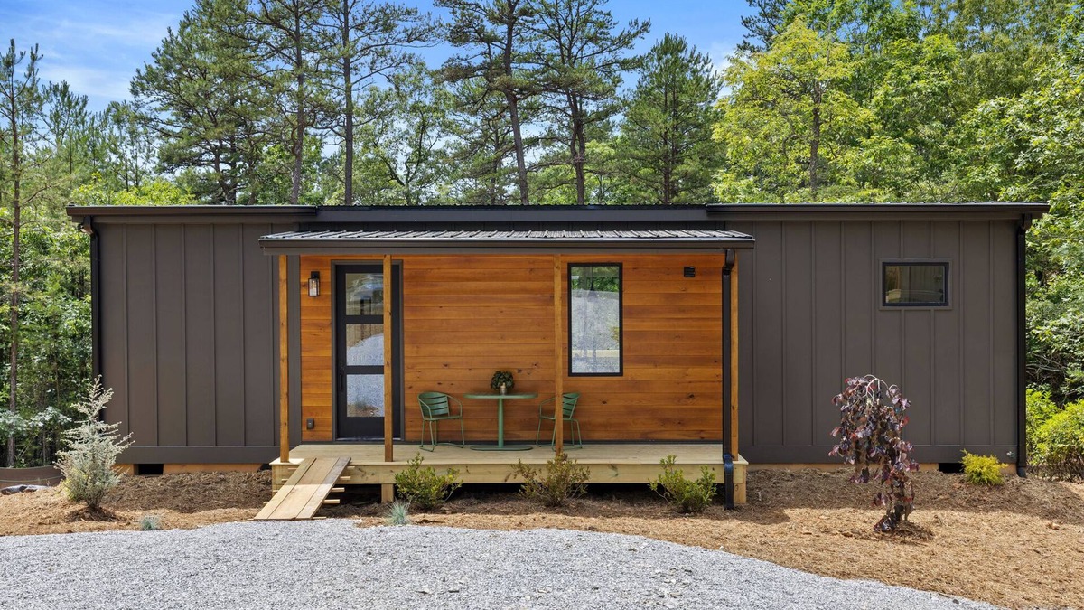 Young Harris Apartment | Escape to a 2BR/1BA tiny home in the North Georgia mountains. Create meals in the chef’s kitchen, cozy up by the wood-burning stove, refresh in the spa-style shower, and enjoy crisp mountain air and brilliant fall colors from your private deck.
