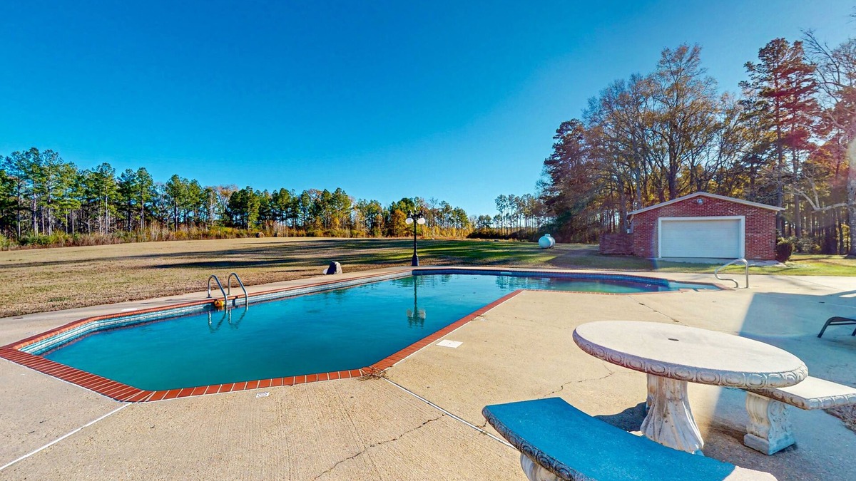 Magnolia House | Expansive property with two homes, ponds, pool, game tables, & hiking trails