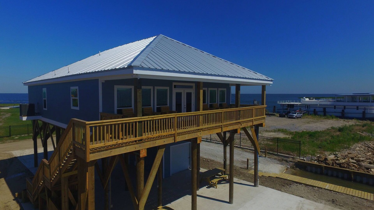 Golden Meadow House | Experience waterfront living at The Pointe in Grand Isle, LA, with 4 bedrooms and boat access.