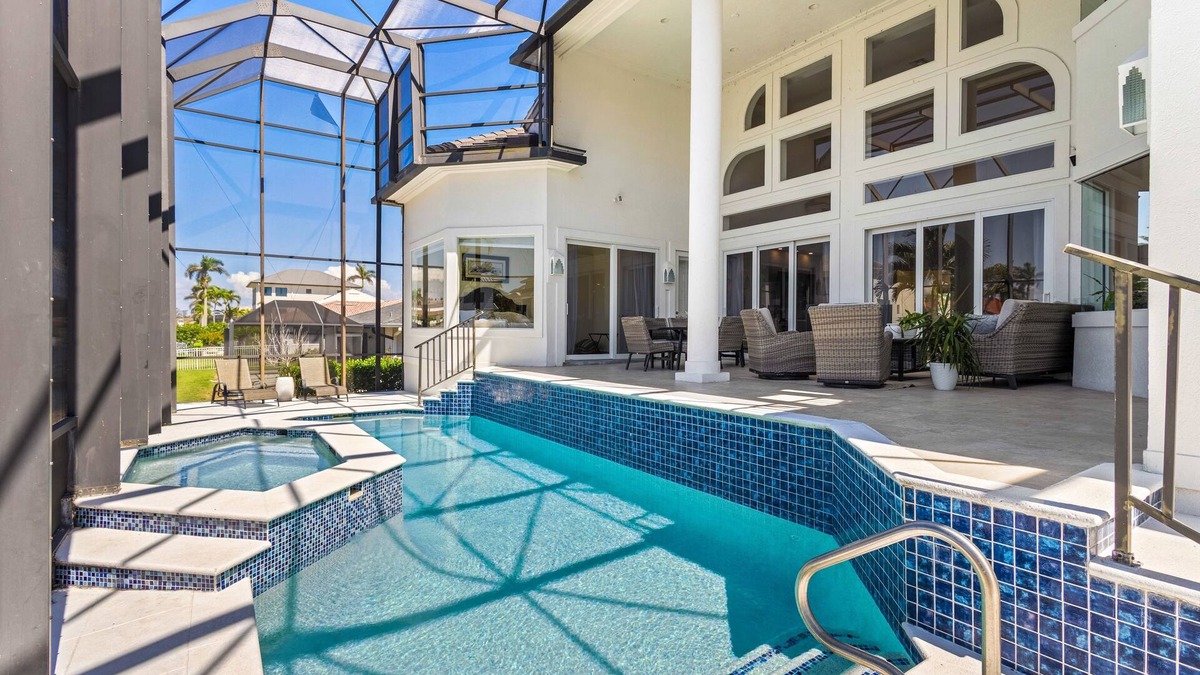 Vanderbilt Beach House | Exquisite waterfront home with lanai, heated pool and spa(hot tub), and internet