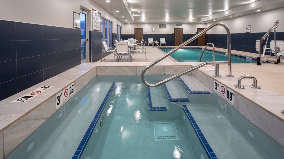 Rapid City Condo | Free Breakfast. Pool & Hot Tub. Near Rushmore Crossing Shopping Complex! Your Next Trip!