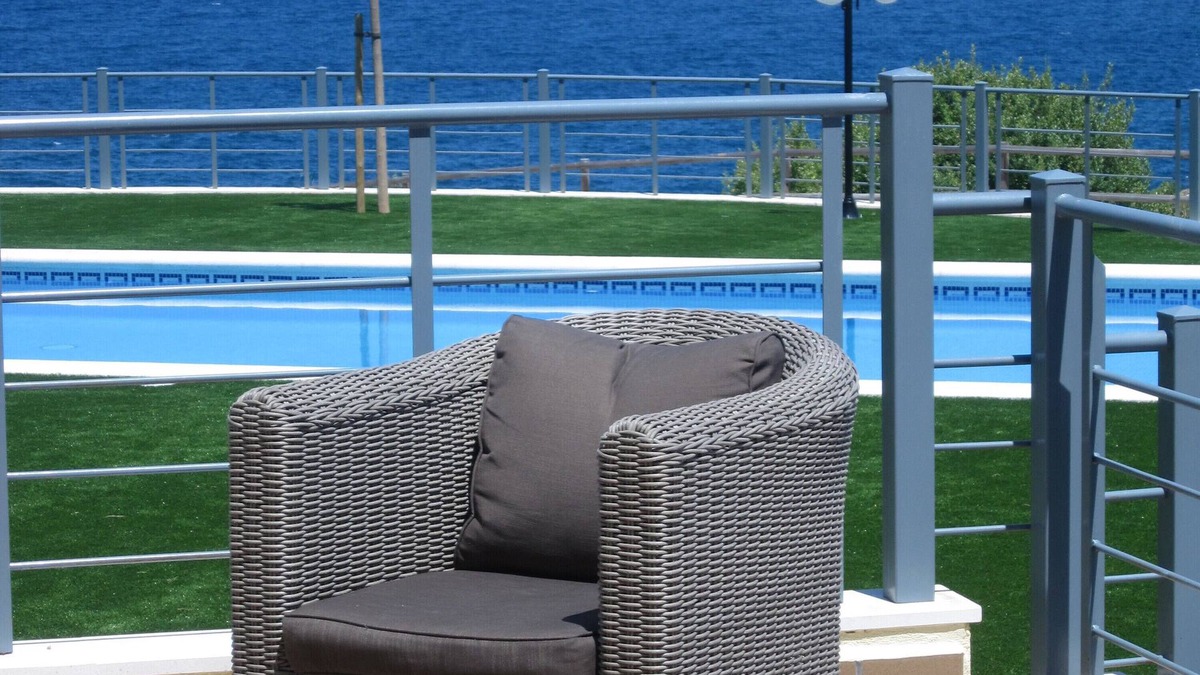 Llanca Apartment | garden level apartment with full sea views in residence with swimming pool.