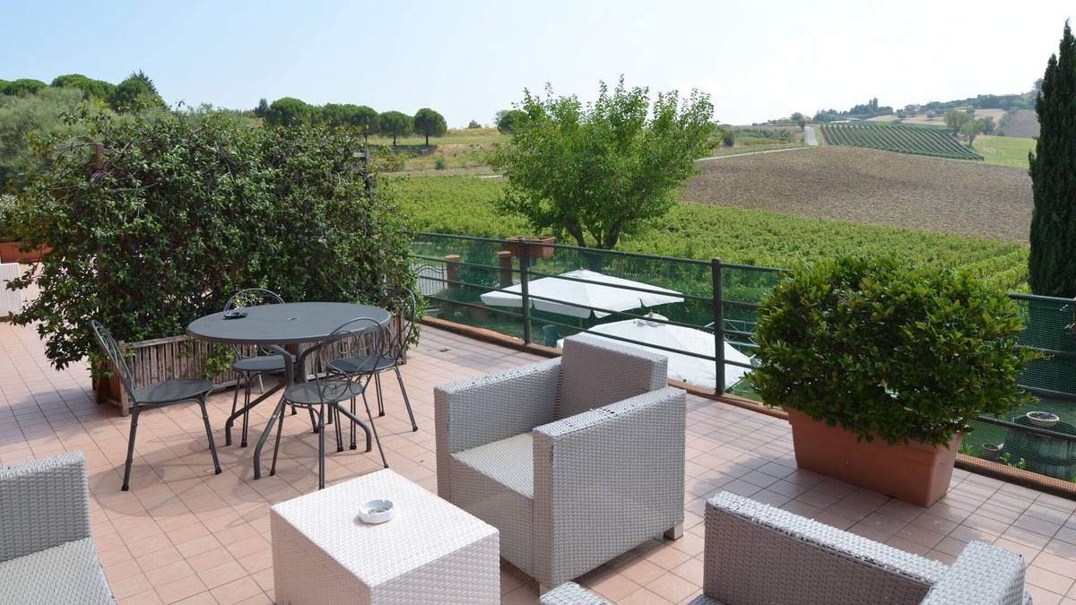 Passano Apartment | Garden-View Apartment in Coriano Italy with Swimming Pool