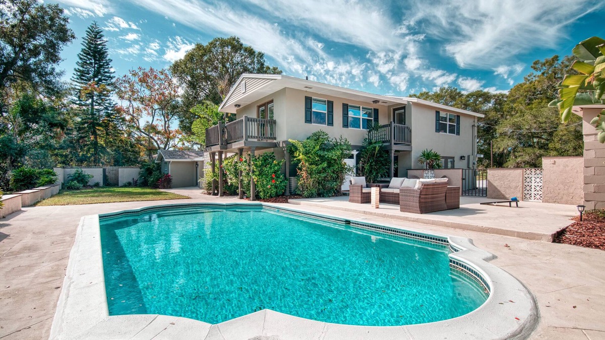 Forest Hills House | Golf Course View, Family Pool Retreat, Game Room! Near USF & Stadiums, Sleeps 14