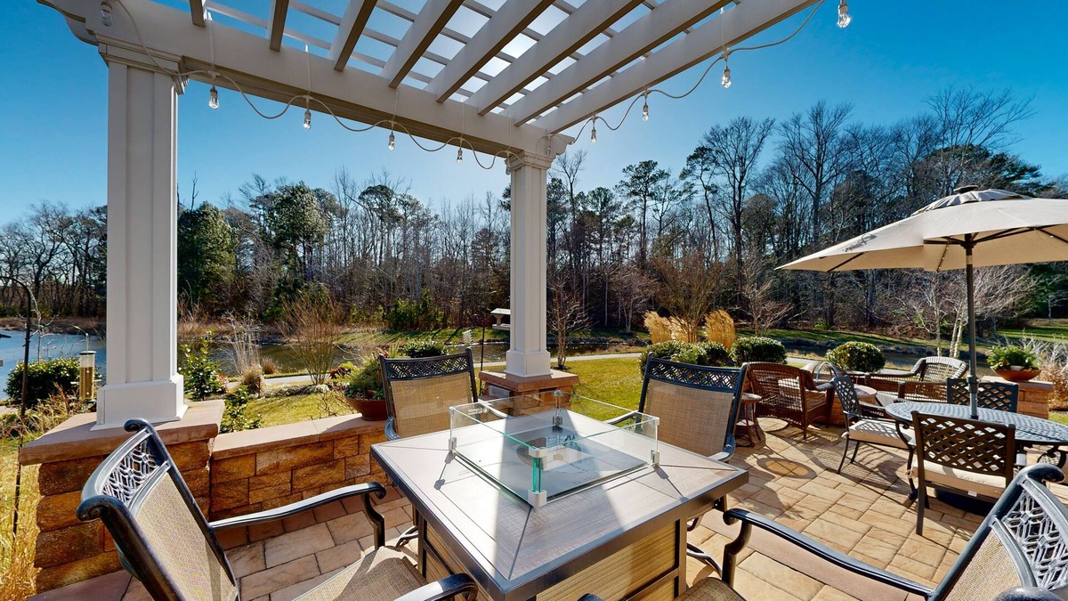 West Beach House | Gorgeous Bay Forest home with resort amenities, raised patio, office, & firepits