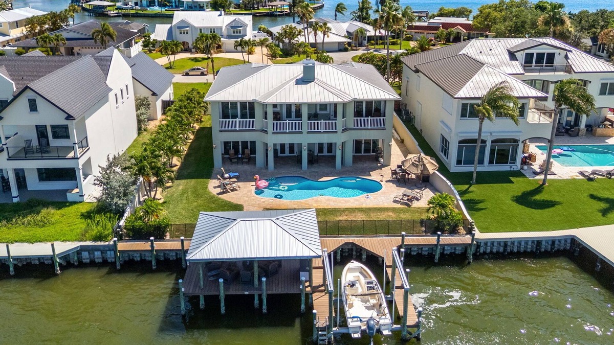 Cocoa Isles Country Club House | Gorgeous Direct Riverfront Pool Home W/Private Balcony, Movie Room, & Fire Pit!