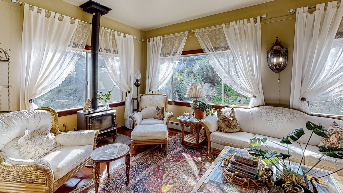 Black Point-Green Point House | Gorgeous river view home with wood stove, sauna, patio, fitness room, & kitchen