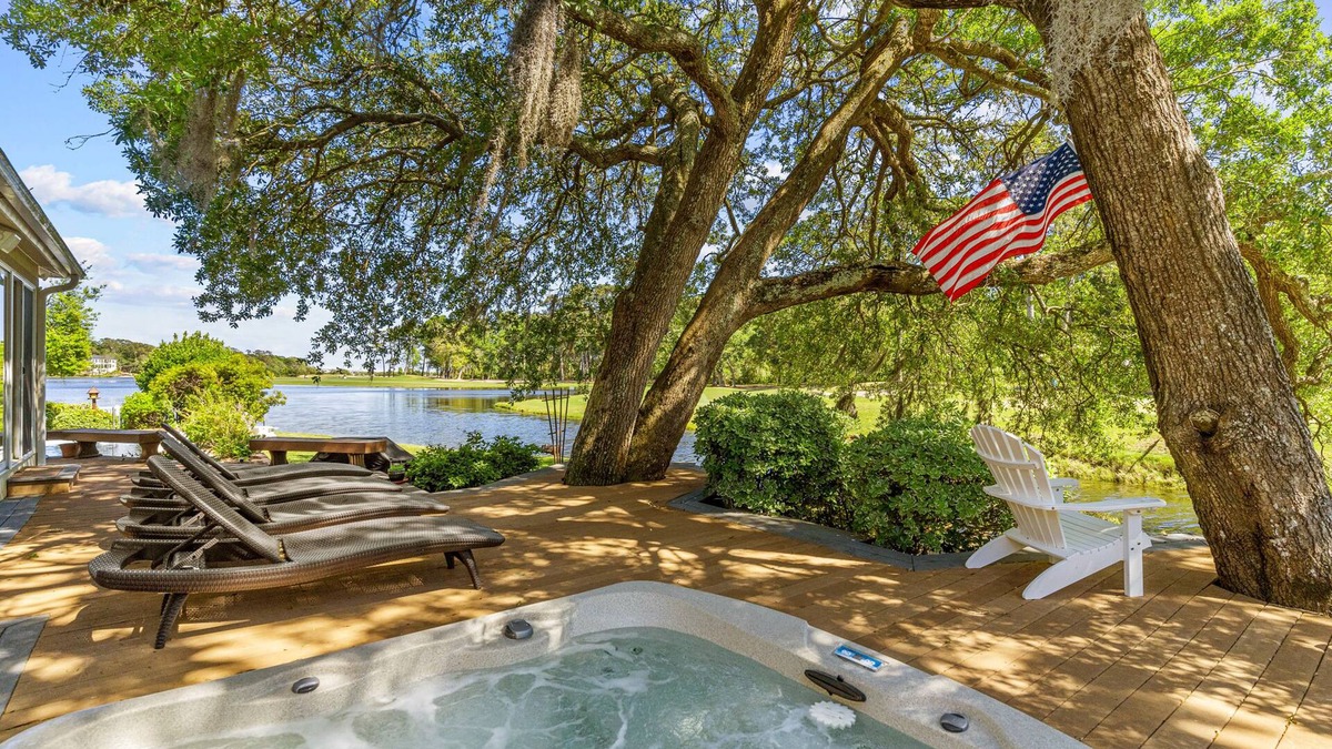 Sea Trail House | Gorgeous waterfront home with private hot tub, pool, views, deck, & fireplace