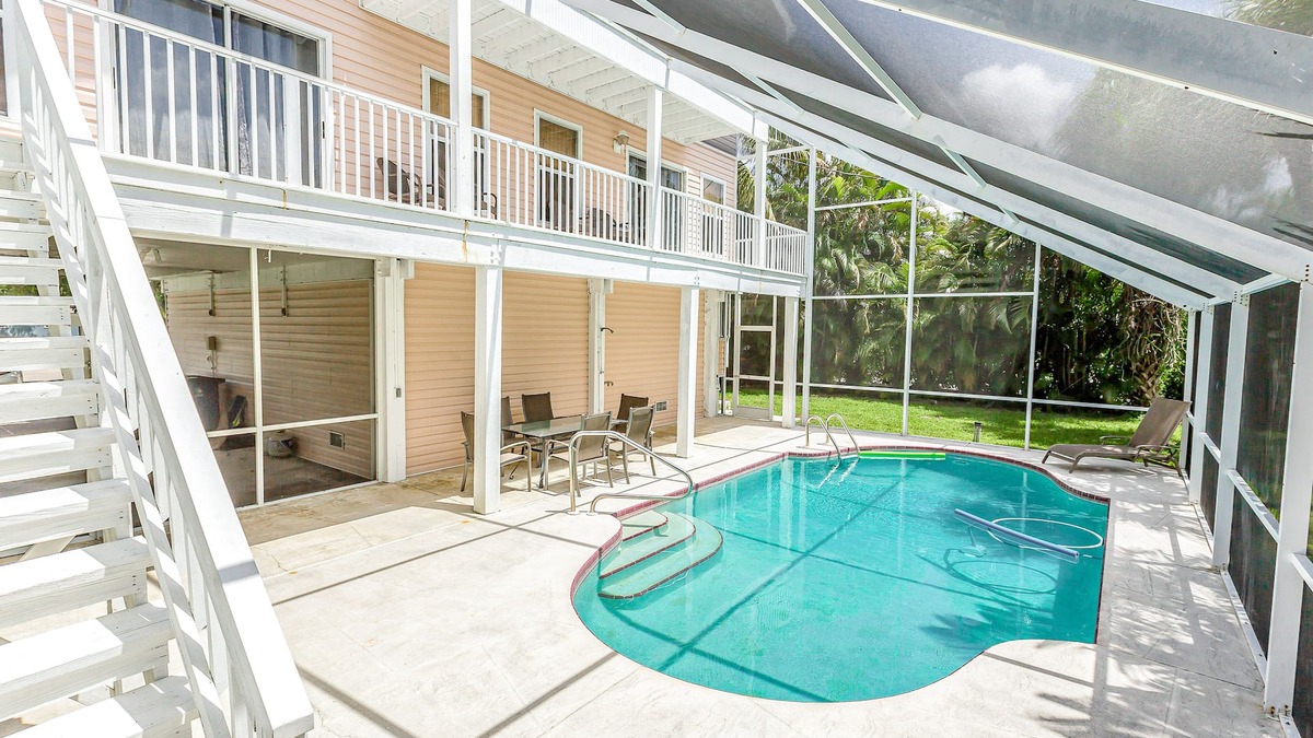 Mid Island House | Group getaway with private pool & lanai - walk to Fort Myers Beach & Estero Bay