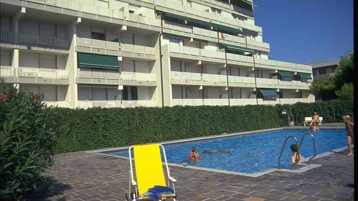Lignano Sabbiadoro Apartment | Holiday apartment with balcony, internet and pool
