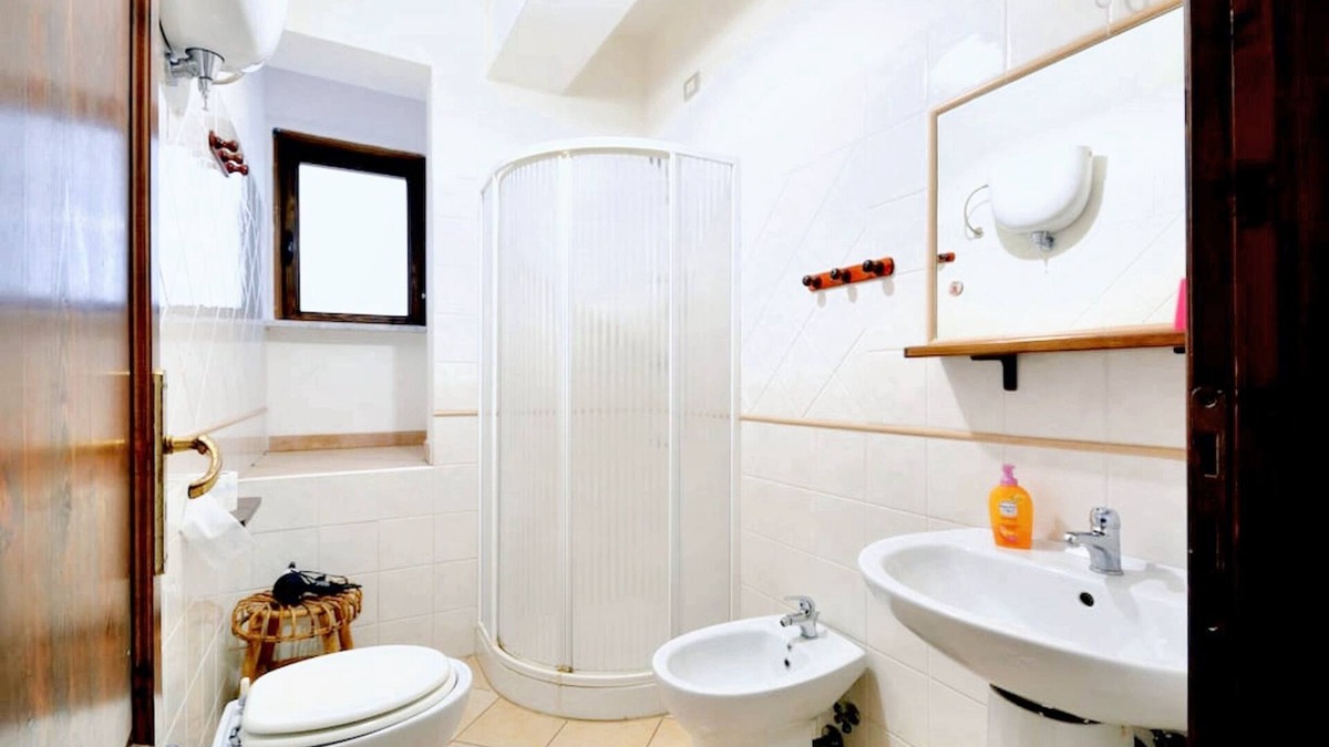 Parghelia Apartment | Homerez - Bright House in Vibo Valentia, Shared Pool