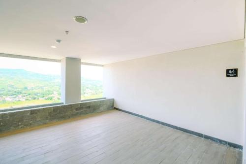 Tajur Halang Apartment | Homey and Restful Studio Royal Sentul Park Apartment By Travelio