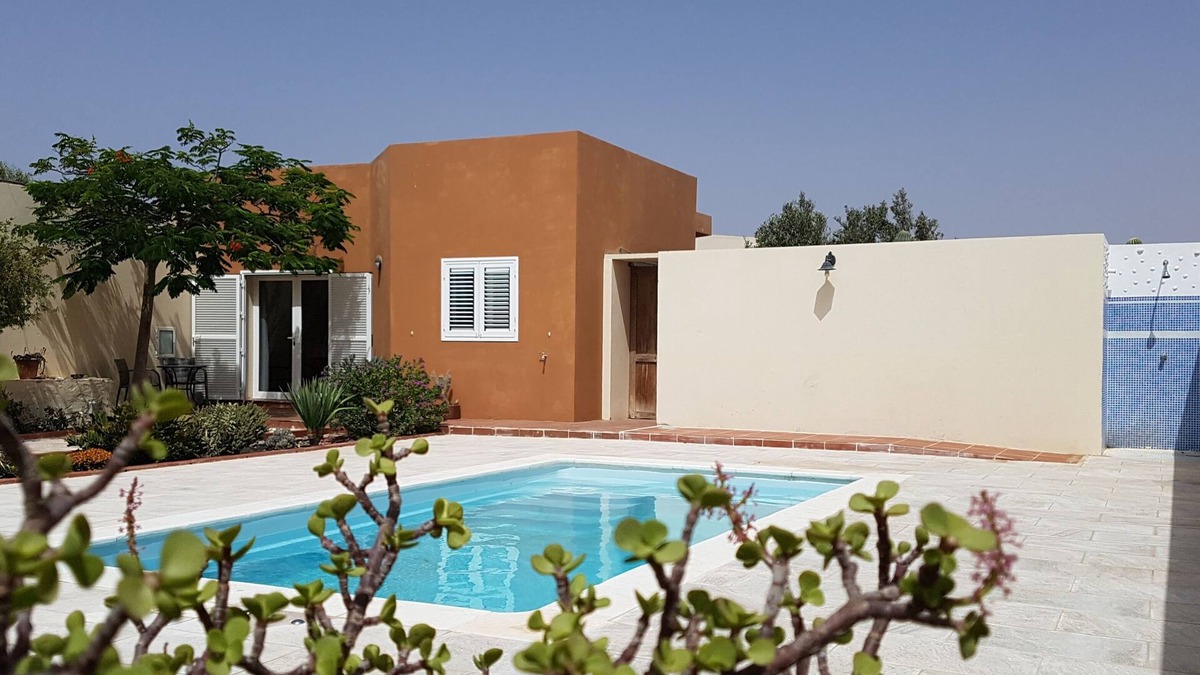 Antigua House | House with pool between gardens and olive farm.