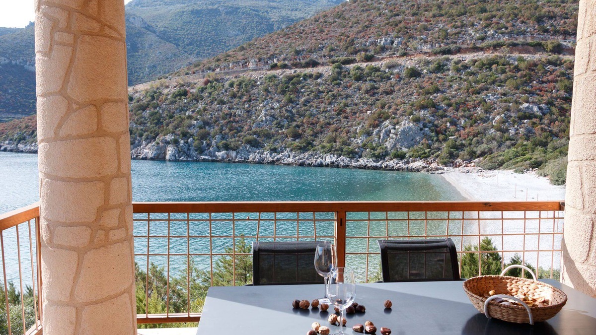 Arkadiko Chorio Apartment | Into The Blue Maisonette: A beautiful stone house on the beach!