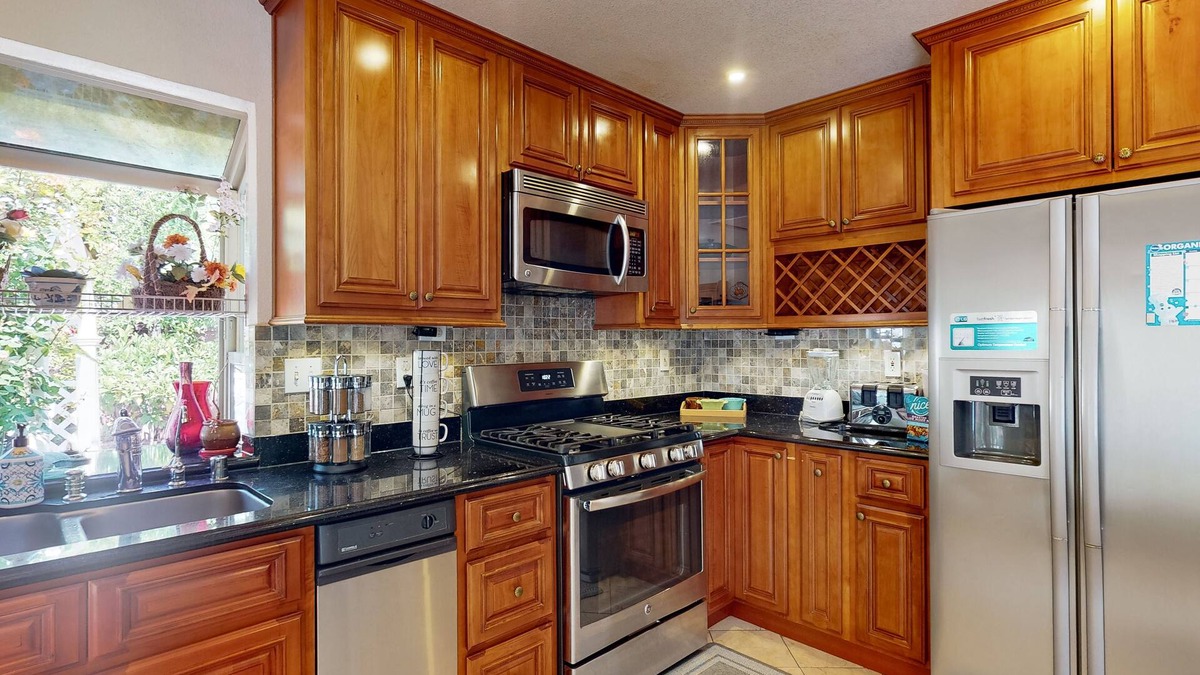 Fremont House | Inviting home with pool, fitness area, fireplace, & W/D