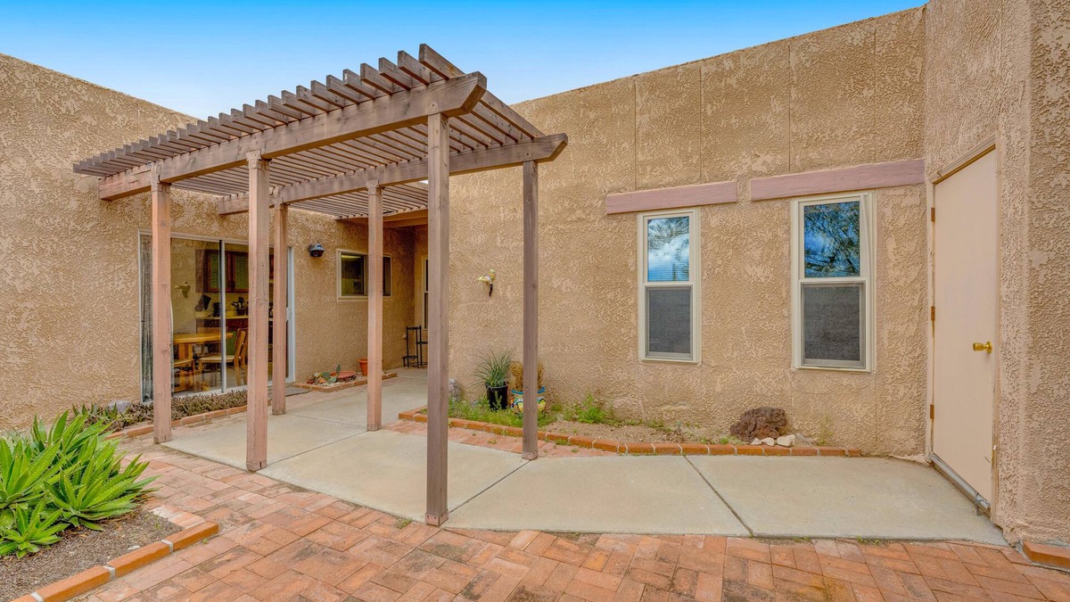 The Foothills Townhomes House | Inviting townhouse with pool, enclosed yard, patio, mountain view & W/D