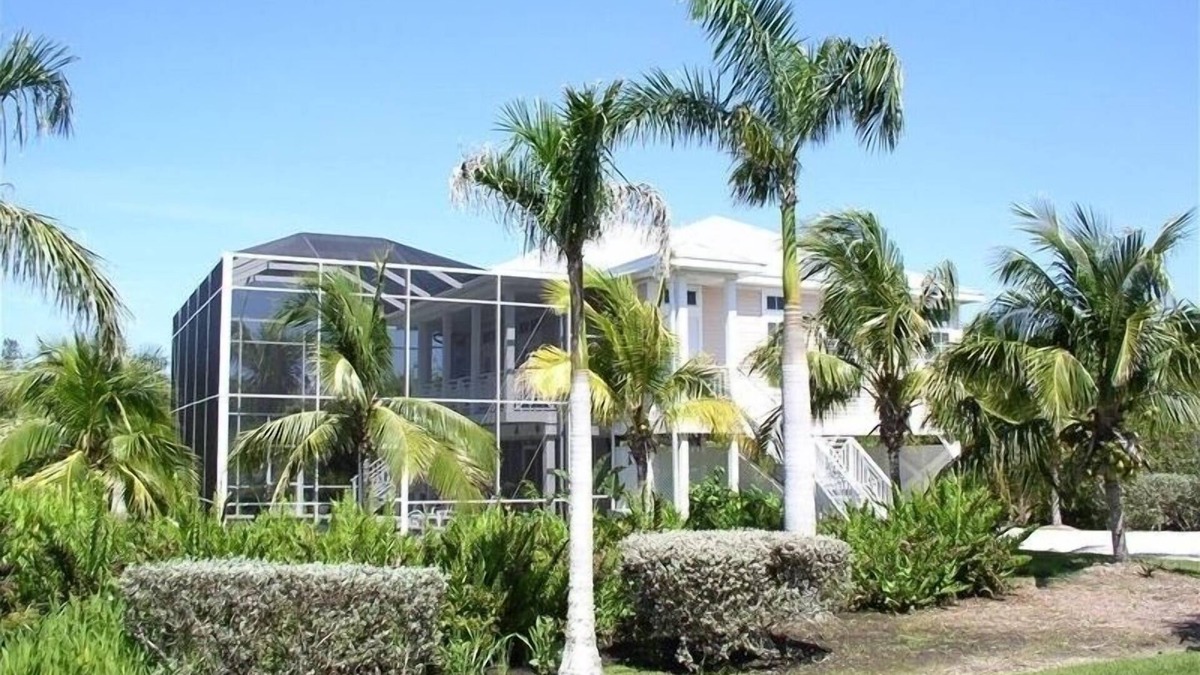 Sanibel House | Key West Style Home. With Screened Heated Pool. Only a 6 Minute Walk To Beach.
