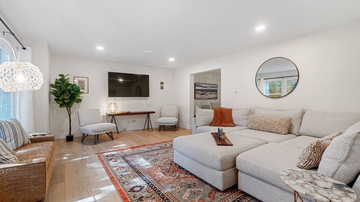 Norton Shores House | Lake MI Nest- perfect for group trips with access to Lake MI & private hot tub!