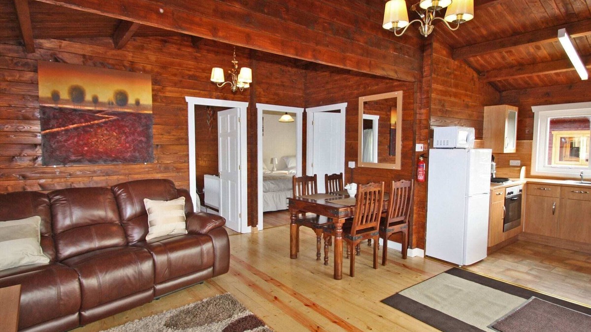 Pontardulais Cottage | Lake side log cabin peacefully situated and each enjoying fabulous lake views.