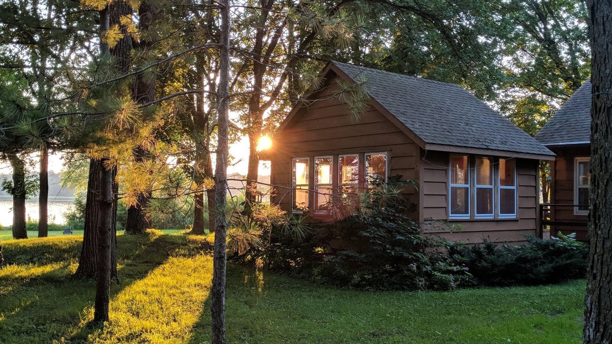 Darwin Cabin | Lake Stella beautiful beach and spacious deck on quiet private drive.