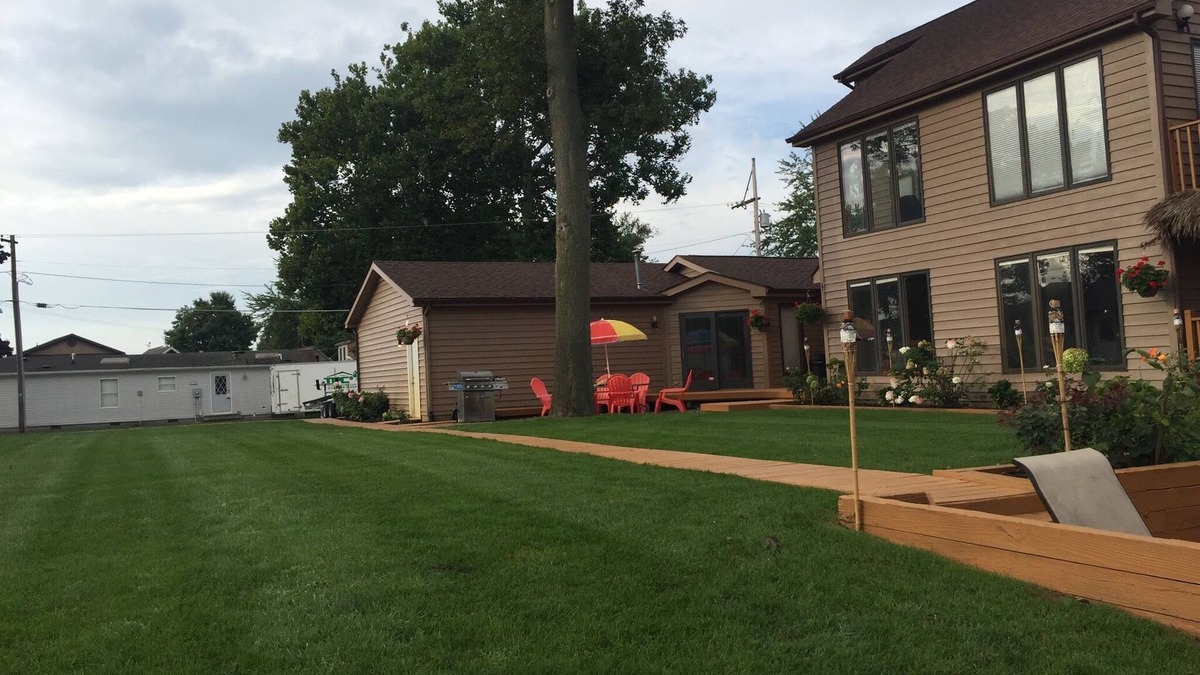Enchanted Hills Condo | Lake Wawasee 2 Bedroom Premier Condo on Channel with 1 Boat Slip, Sleeps 6,