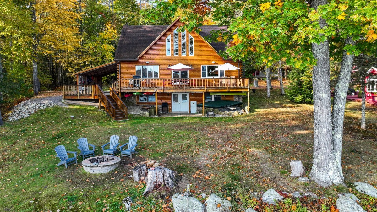 Norway House | Lakefront, dog-friendly home with dock, kayaks, SUPs, canoe, huge deck & firepit