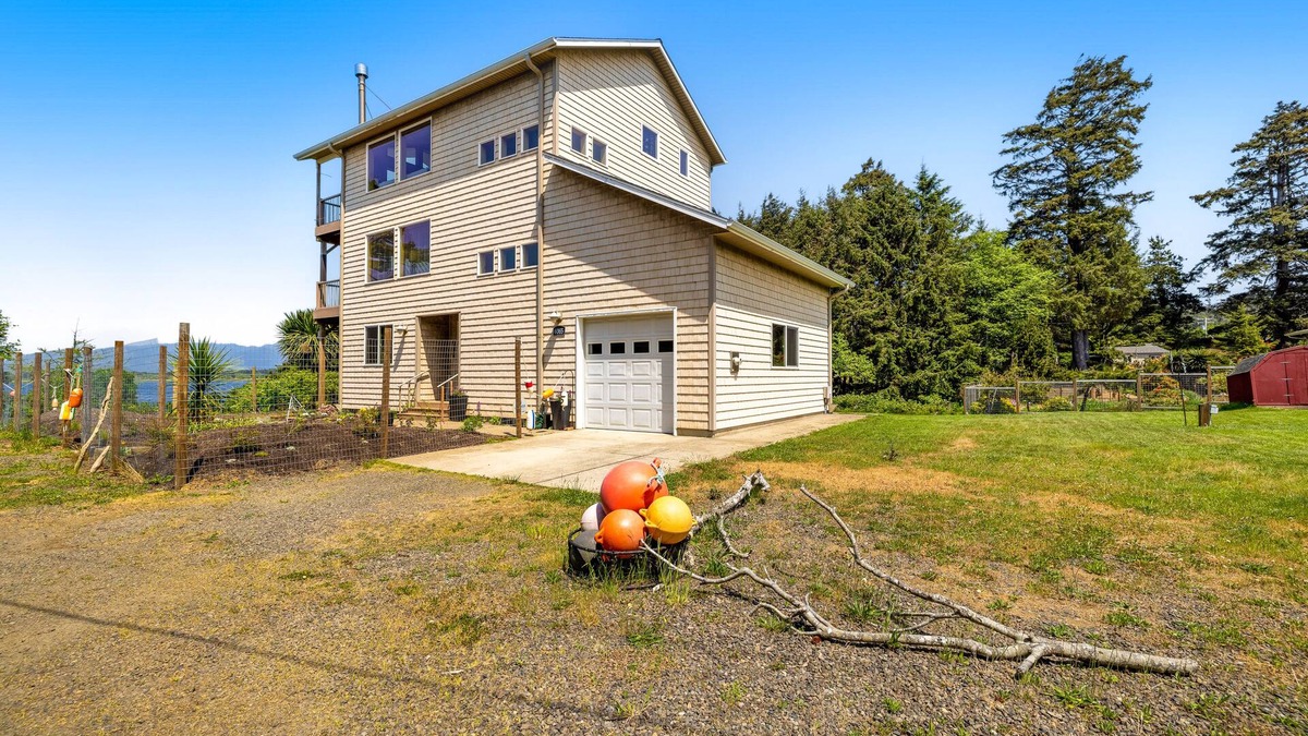 Cape Meares House | Lakefront escape with water views, grill, wrap-around deck - walk to beach