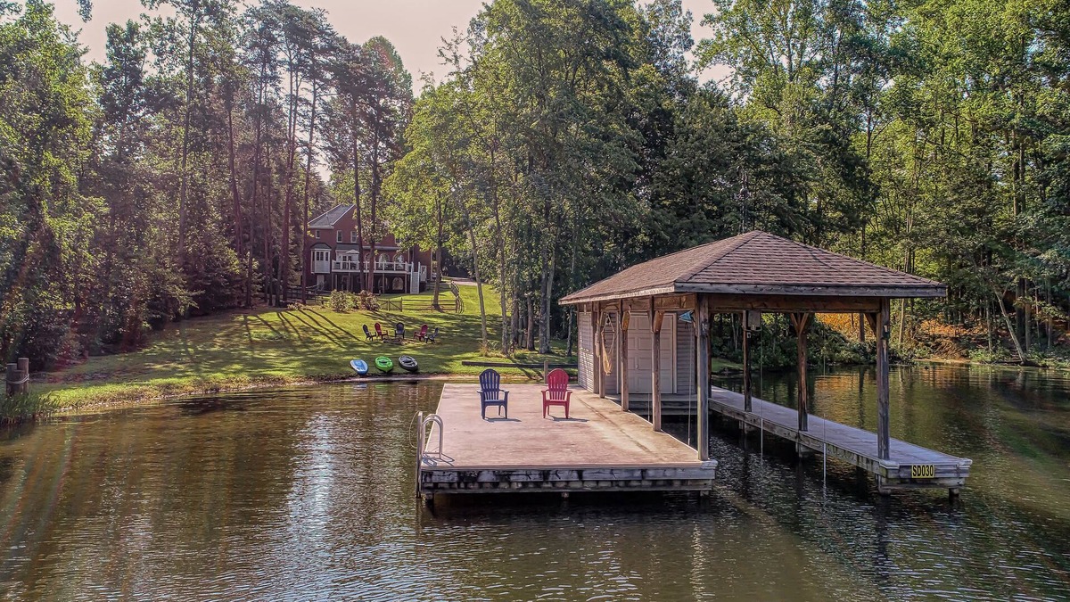 Lakeside Woods House | Lakefront home with boat dock, private firepit & game room - dog-friendly