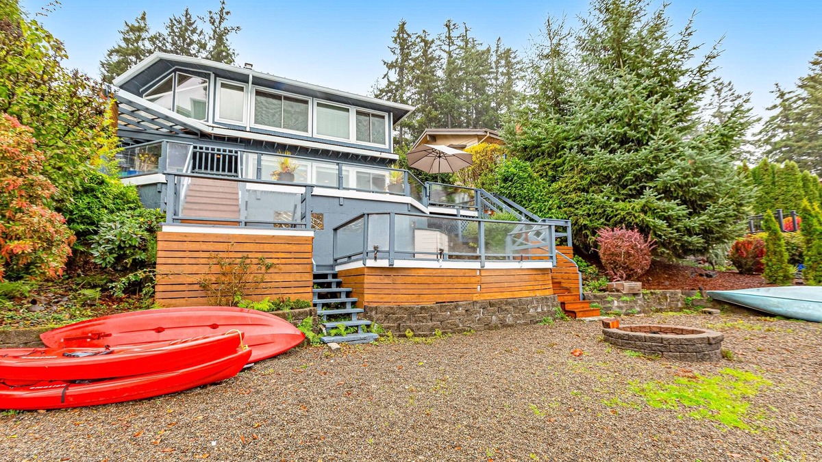 Olympia House | Lakefront home with canoe, kayaks, large deck, beach access, fireplace, & W/D