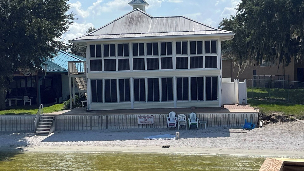 Babson Park House | Lakefront home with white sand beach and private boat dock on Crooked Lake.