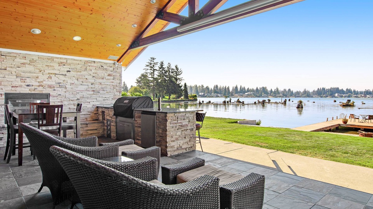 Bonney Lake House | Lakefront house with built-in bar & grill, fireplace, beach, & dock