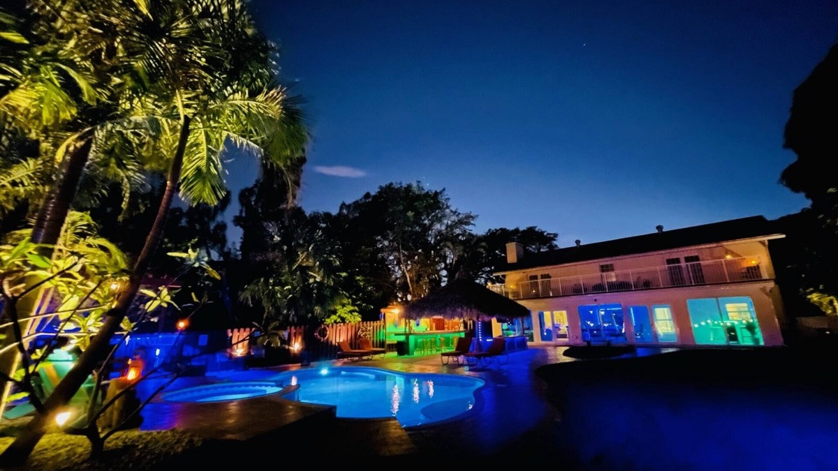 Lake Worth House | Lakefront Oasis 6BD, Sleep 14, Heated Pool, Tikis, Golf, Dock on Lake, No Stairs